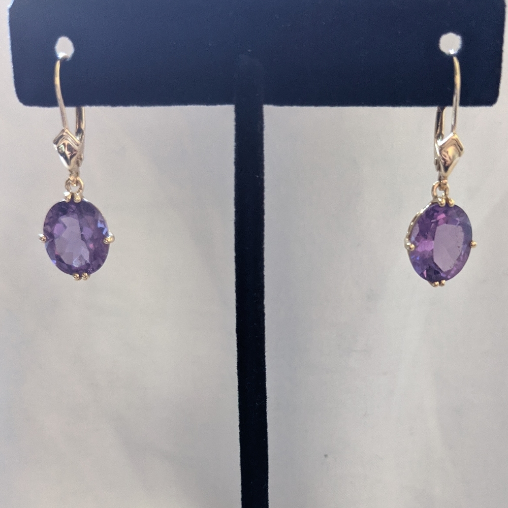 14 K gold earrings with purple stones